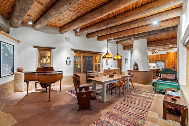 26 Camino Los Angelitos, Santa Fe, NM 87540 - dining area with wooden ceiling with exposed beams and concrete floors