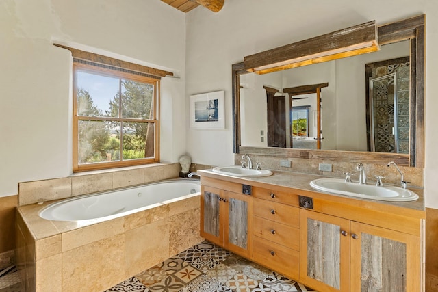 26 Camino Los Angelitos, Santa Fe, NM 87540 - bathroom featuring a bath, double vanity, a stall shower, and tile patterned flooring