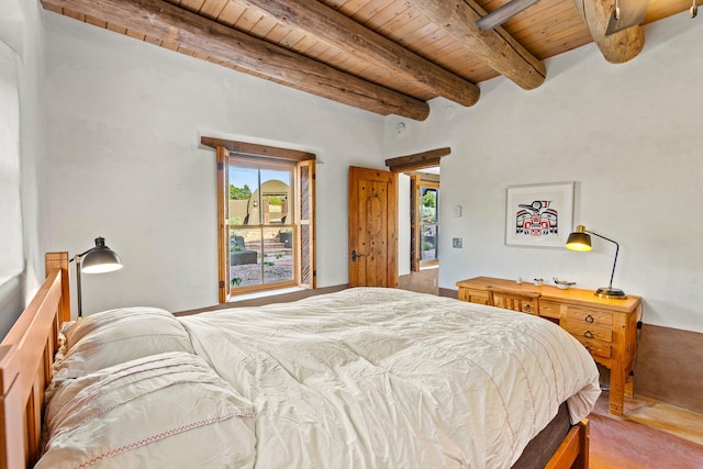 26 Camino Los Angelitos, Santa Fe, NM 87540 - bedroom with wood ceiling with exposed beams