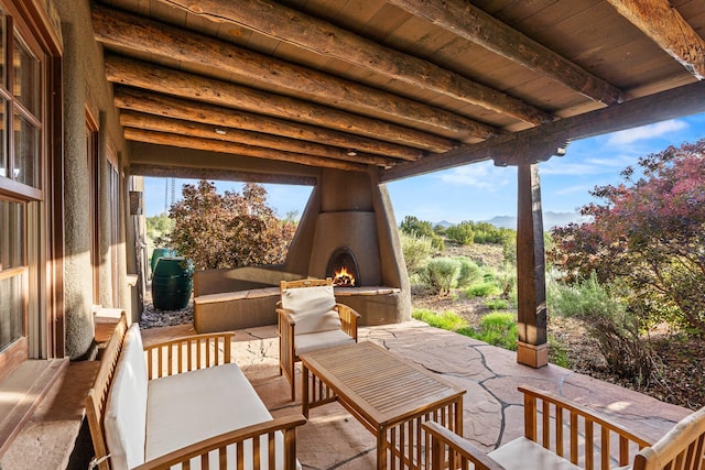26 Camino Los Angelitos, Santa Fe, NM 87540 - view of patio with an outdoor living space with a fireplace