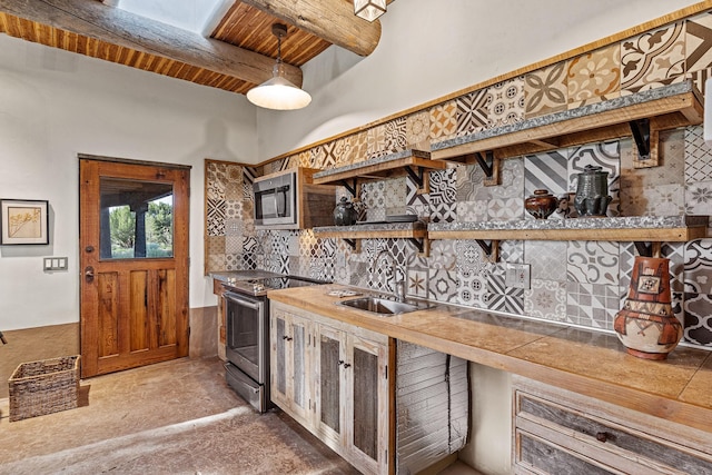 26 Camino Los Angelitos, Santa Fe, NM 87540 - bar with stainless steel appliances, a sink, wood ceiling with exposed beams, and decorative backsplash