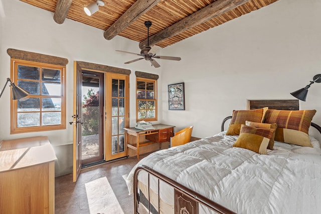 26 Camino Los Angelitos, Santa Fe, NM 87540 - bedroom featuring wooden ceiling with exposed beams, concrete floors, and access to outside