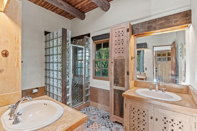 26 Camino Los Angelitos, Santa Fe, NM 87540 - full bathroom featuring wood ceiling with exposed beams, a shower stall, and two vanities
