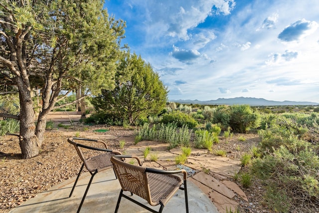 26 Camino Los Angelitos, Santa Fe, NM 87540 - view of patio / terrace featuring a mountain view