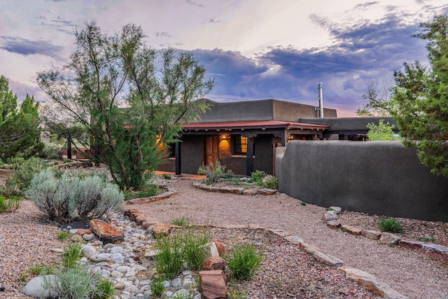 26 Camino Los Angelitos, Santa Fe, NM 87540 - view of front of property featuring stucco siding