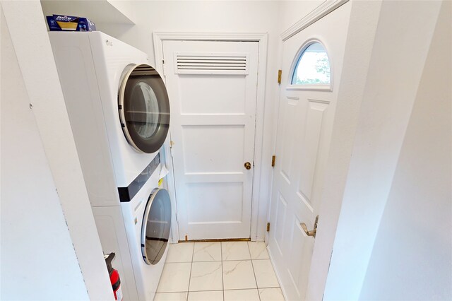 4030 Urban Unit C, Los Alamos, NM 87544 - washroom with stacked washing machine and dryer and light marble finish flooring