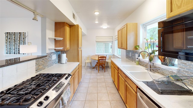 4030 Urban Unit C, Los Alamos, NM 87544 - kitchen featuring black microwave, stainless steel gas range oven, a sink, backsplash, and open shelves