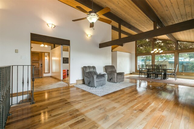 215 San Juan St, Los Alamos, NM 87544 - sitting room with high vaulted ceiling, wood-type flooring, a chandelier, a ceiling fan, and baseboards