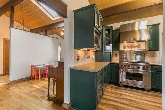 215 San Juan St, Los Alamos, NM 87544 - kitchen with wall chimney range hood, stainless steel appliances, green cabinetry, a skylight, and wooden ceiling