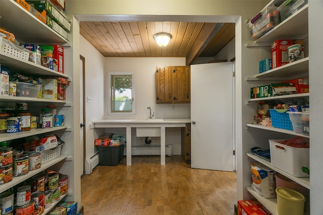 215 San Juan St, Los Alamos, NM 87544 - storage area featuring a baseboard heating unit and a sink