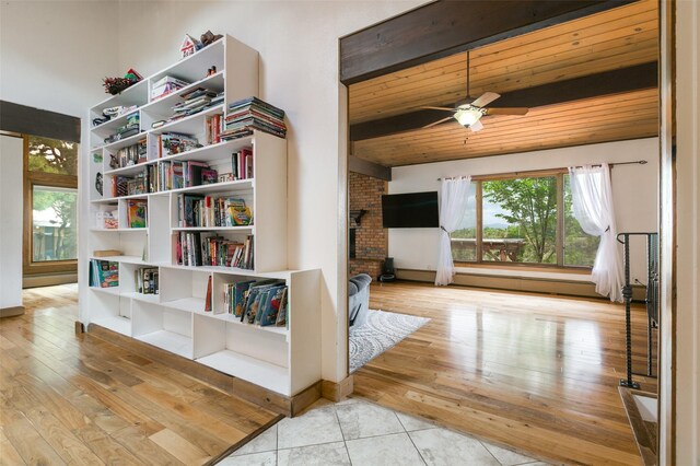 215 San Juan St, Los Alamos, NM 87544 - living area featuring plenty of natural light, a ceiling fan, wood ceiling, a fireplace, and hardwood / wood-style flooring