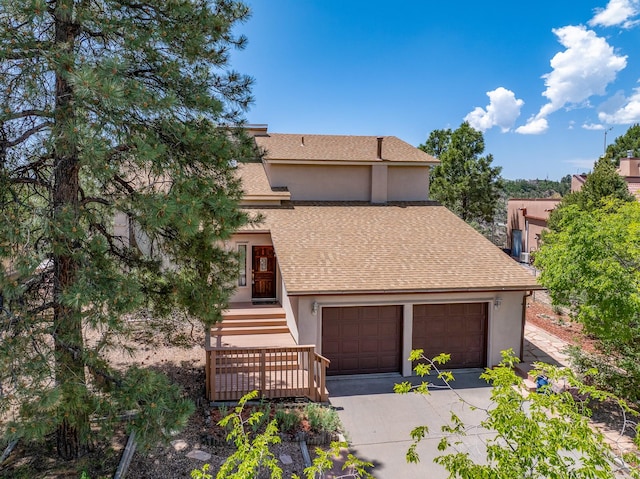 1327 San Ildefonso Rd, Los Alamos, NM 87544 - view of front of home with stucco siding, roof with shingles, and a garage