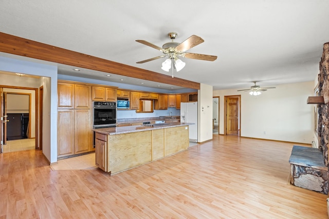1327 San Ildefonso Rd, Los Alamos, NM 87544 - kitchen with oven, stainless steel microwave, a ceiling fan, light wood finished floors, and recessed lighting