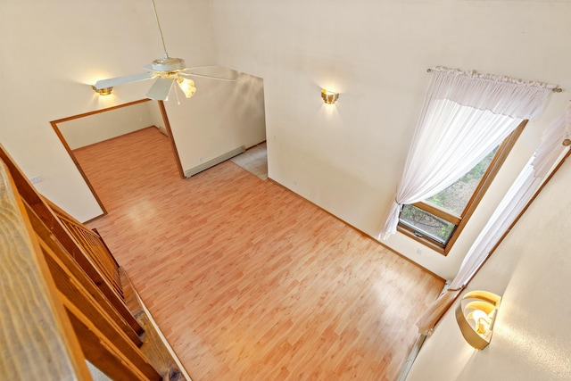 1327 San Ildefonso Rd, Los Alamos, NM 87544 - unfurnished living room featuring light wood finished floors and ceiling fan