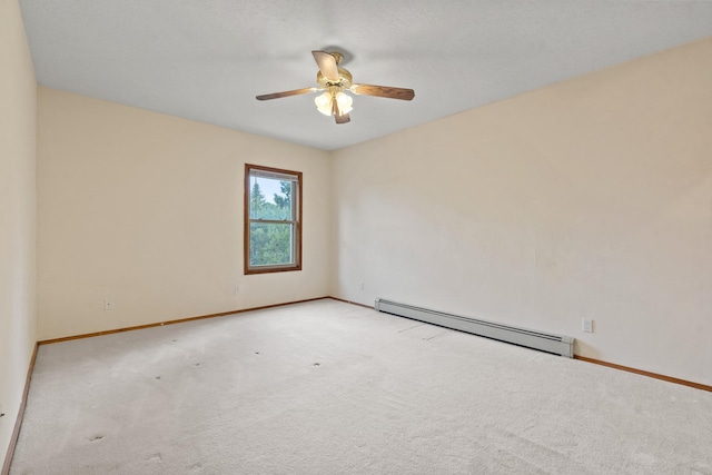 1327 San Ildefonso Rd, Los Alamos, NM 87544 - carpeted empty room featuring a baseboard radiator, a ceiling fan, and baseboards