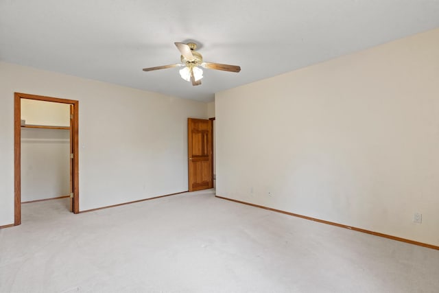 1327 San Ildefonso Rd, Los Alamos, NM 87544 - unfurnished bedroom featuring light carpet, baseboards, and a spacious closet