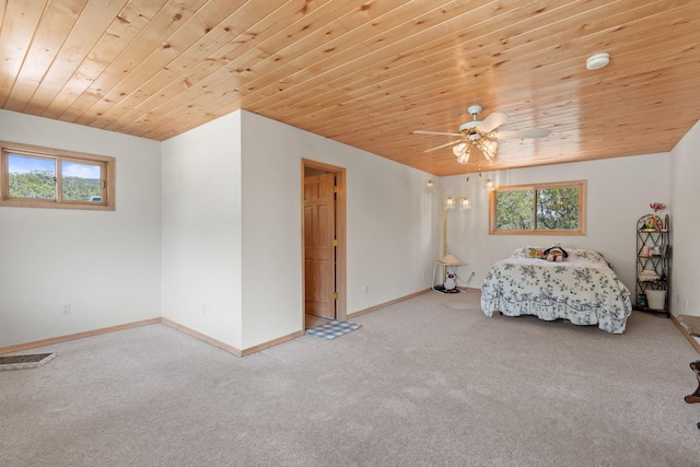 71 Apache Plume Dr, Santa Fe, NM 87508 - carpeted bedroom featuring wood ceiling, baseboards, and ceiling fan