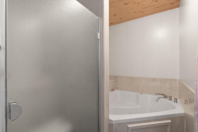 71 Apache Plume Dr, Santa Fe, NM 87508 - bathroom featuring a garden tub, wooden ceiling, and a shower stall