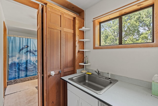 71 Apache Plume Dr, Santa Fe, NM 87508 - kitchen featuring a sink and white cabinets