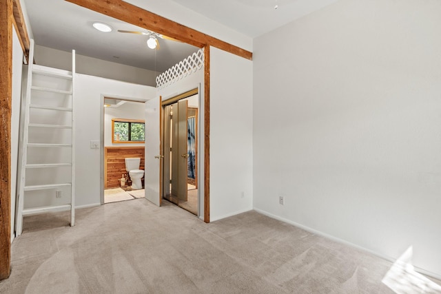 71 Apache Plume Dr, Santa Fe, NM 87508 - unfurnished bedroom with carpet, a closet, baseboards, and a ceiling fan