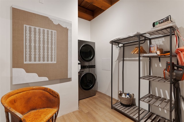 749 Alto St Unit A, Santa Fe, NM 87501 - laundry area featuring stacked washer / dryer, wood finished floors, and wooden ceiling