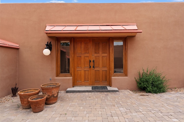 749 Alto St Unit A, Santa Fe, NM 87501 - view of exterior entry with stucco siding