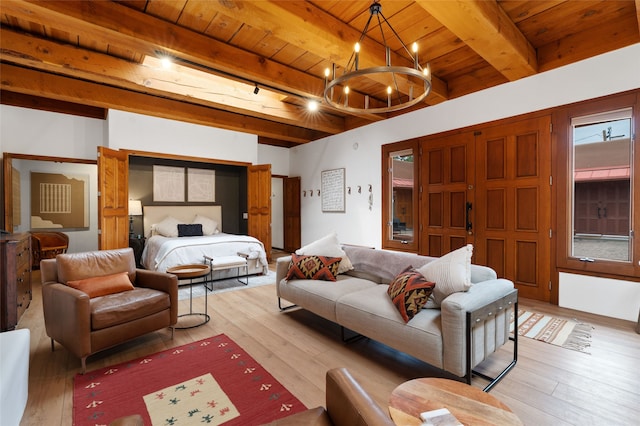 749 Alto St Unit A, Santa Fe, NM 87501 - bedroom with wood ceiling with exposed beams, a chandelier, and light wood-style floors