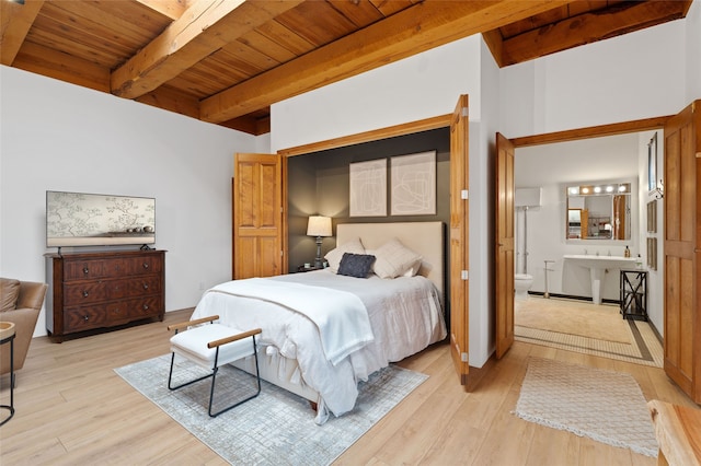 749 Alto St Unit A, Santa Fe, NM 87501 - bedroom with wood ceiling with exposed beams, light wood finished floors, and ensuite bathroom