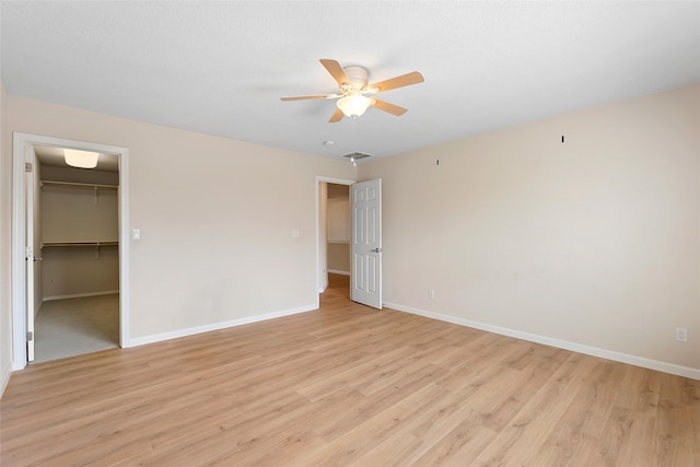 2613 Camino Catalonia, Rio Rancho, NM 87124 - unfurnished bedroom featuring baseboards, light wood-style flooring, and ceiling fan