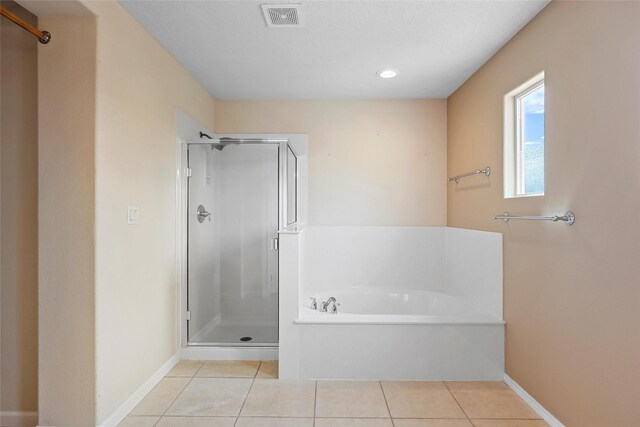 2613 Camino Catalonia, Rio Rancho, NM 87124 - full bath with a stall shower, tile patterned floors, a garden tub, baseboards, and recessed lighting