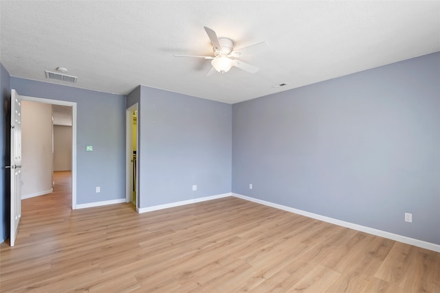 2613 Camino Catalonia, Rio Rancho, NM 87124 - unfurnished room with a ceiling fan, light wood-type flooring, and baseboards