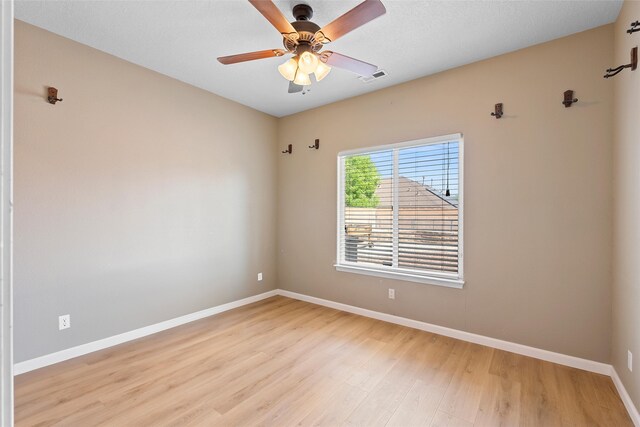 2613 Camino Catalonia, Rio Rancho, NM 87124 - empty room featuring light wood-type flooring, baseboards, and a ceiling fan
