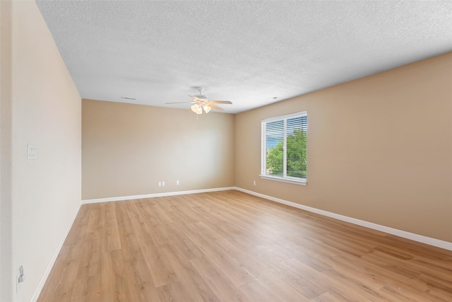 2613 Camino Catalonia, Rio Rancho, NM 87124 - unfurnished room featuring ceiling fan, light wood-type flooring, a textured ceiling, and baseboards