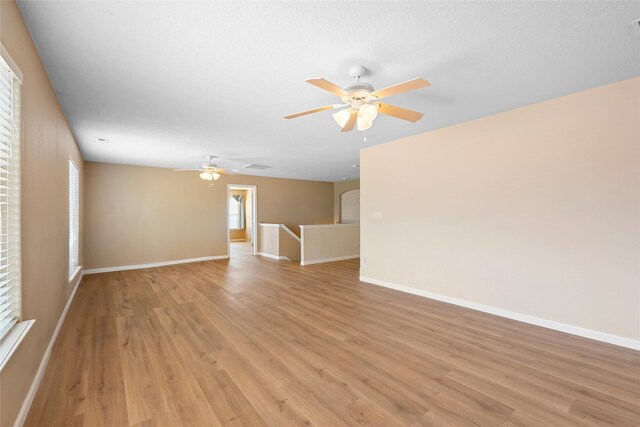 2613 Camino Catalonia, Rio Rancho, NM 87124 - empty room featuring light wood finished floors, ceiling fan, and baseboards