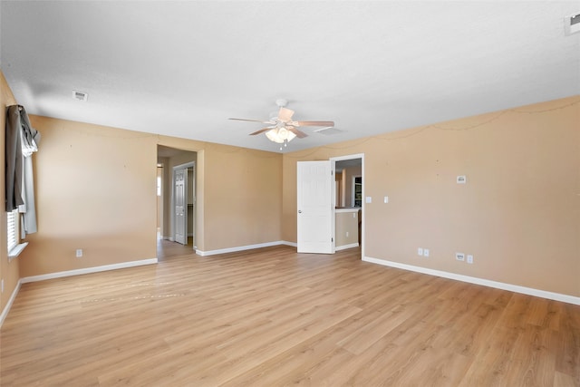 2613 Camino Catalonia, Rio Rancho, NM 87124 - empty room with a ceiling fan, light wood-type flooring, and baseboards