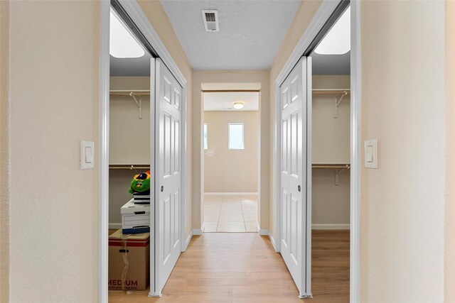 2613 Camino Catalonia, Rio Rancho, NM 87124 - hall with light wood-style flooring and baseboards