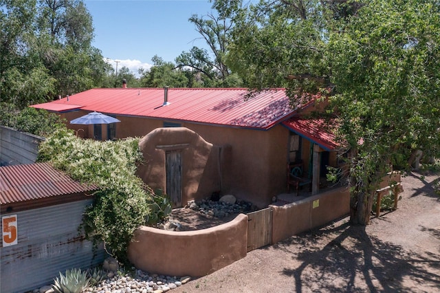 3 Waldo, Cerrillos, NM 87010 - view of side of home featuring metal roof