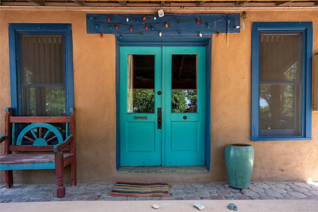 3 Waldo, Cerrillos, NM 87010 - view of exterior entry featuring french doors and stucco siding
