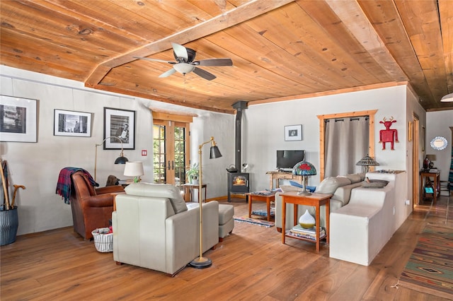 3 Waldo, Cerrillos, NM 87010 - living area featuring wooden ceiling, a wood stove, ceiling fan, hardwood / wood-style floors, and french doors
