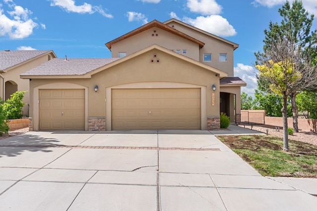 6280 Nardos Rd NW, Albuquerque, NM 87114 - view of front of property with stone siding, stucco siding, and driveway