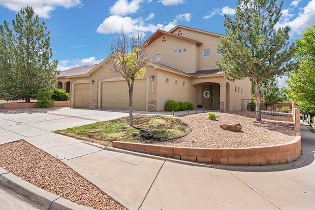6280 Nardos Rd NW, Albuquerque, NM 87114 - mediterranean / spanish-style home with stucco siding, driveway, and an attached garage