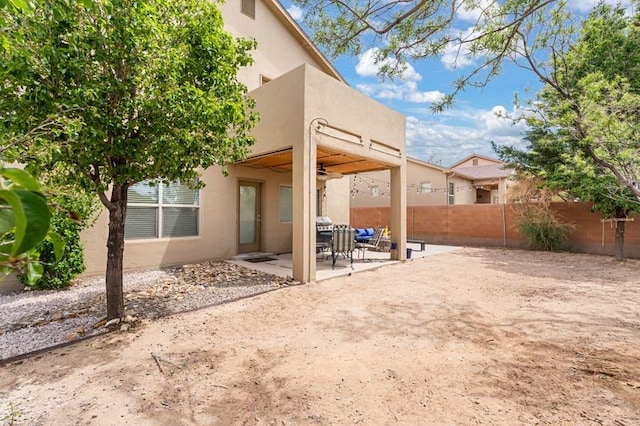 6280 Nardos Rd NW, Albuquerque, NM 87114 - back of house with stucco siding, a fenced backyard, and a patio