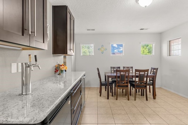 6280 Nardos Rd NW, Albuquerque, NM 87114 - dining area with healthy amount of natural light, light tile patterned floors, and baseboards