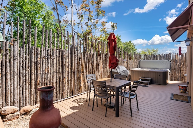 505 Juniper Dr Unit B, Santa Fe, NM 87501 - wooden deck with a hot tub, outdoor dining area, and area for grilling