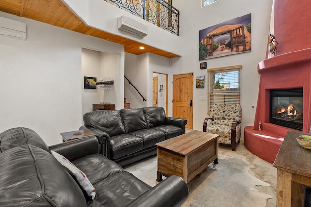 505 Juniper Dr Unit B, Santa Fe, NM 87501 - living room with a large fireplace, an AC wall unit, stairway, light carpet, and a high ceiling