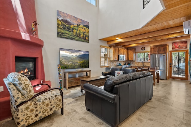 505 Juniper Dr Unit B, Santa Fe, NM 87501 - living area featuring a fireplace, a towering ceiling, and wood ceiling