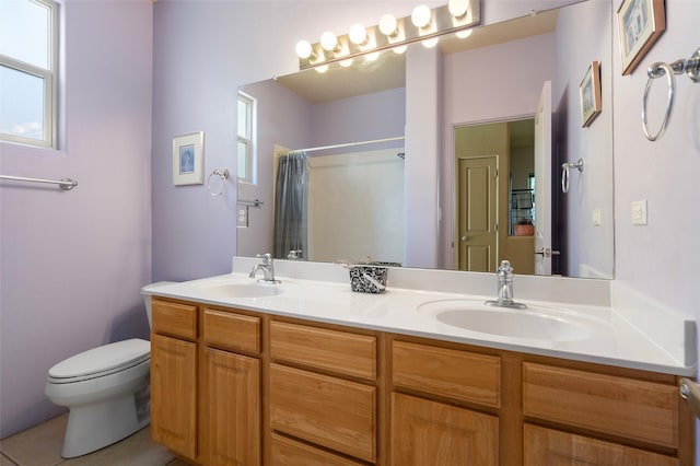 15 Cimarron Pass, Santa Fe, NM 87508 - full bath with double vanity, toilet, curtained shower, and tile patterned flooring