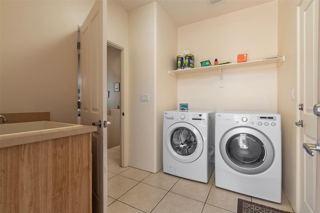 15 Cimarron Pass, Santa Fe, NM 87508 - laundry area with light tile patterned floors and washer and dryer