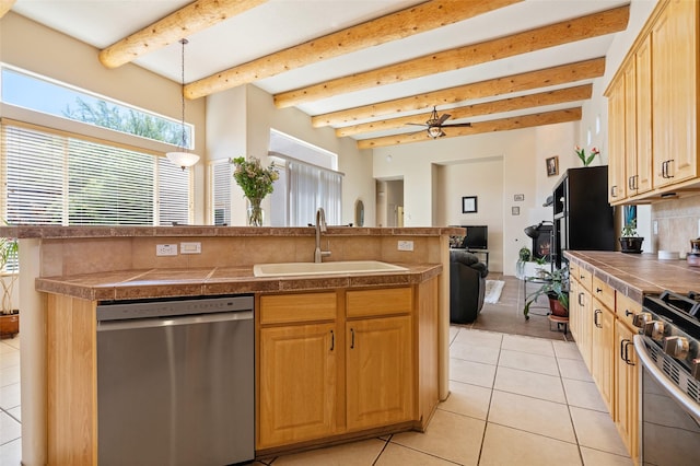 15 Cimarron Pass, Santa Fe, NM 87508 - kitchen with stainless steel appliances, a sink, open floor plan, light tile patterned flooring, and beam ceiling