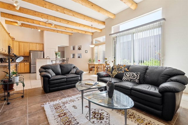 15 Cimarron Pass, Santa Fe, NM 87508 - living room with a high ceiling, beam ceiling, and light tile patterned flooring